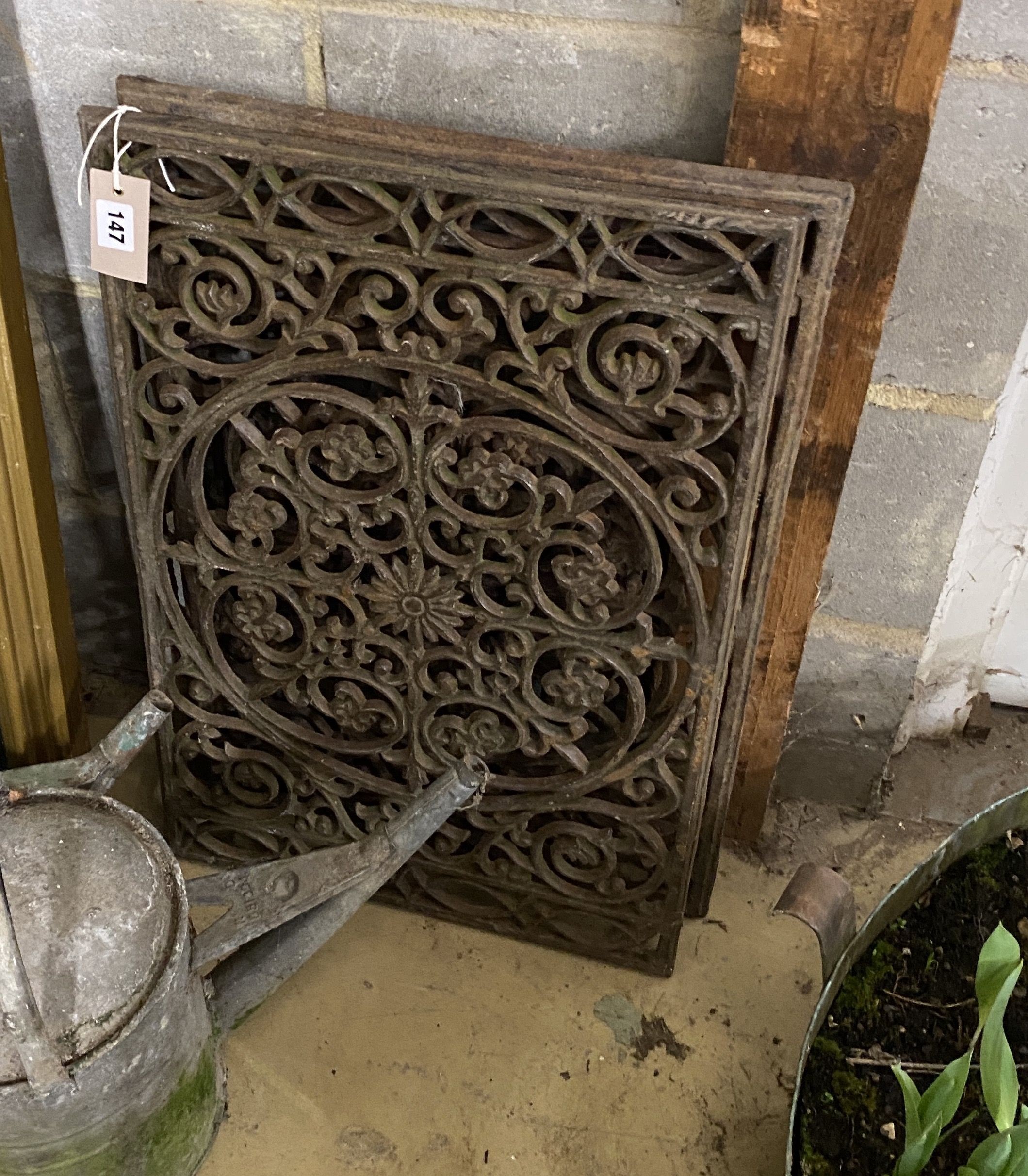 Three Victorian style rectangular cast iron panels, largest width 64cm, height 41cm